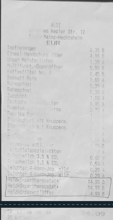 Zerknitterter, blasser ALDI-Kassenbon von 2013 mit Kugelschreiber-Markierungen